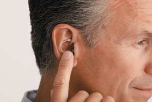 Hearing aid and middle-aged man