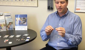 Scott Hyde demonstrating how to change filter of a Beltone Legend hearing aid