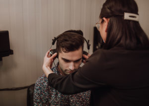 Young man receiving his annual hearing test at Beltone Hearing Center in Langley
