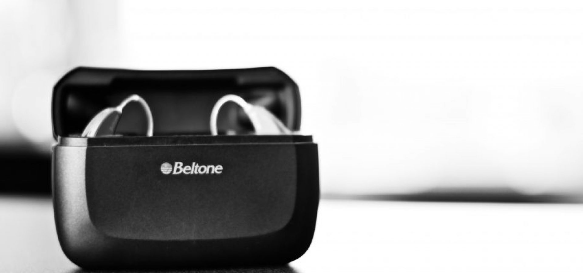 Black and white photo of Beltone hearing aids