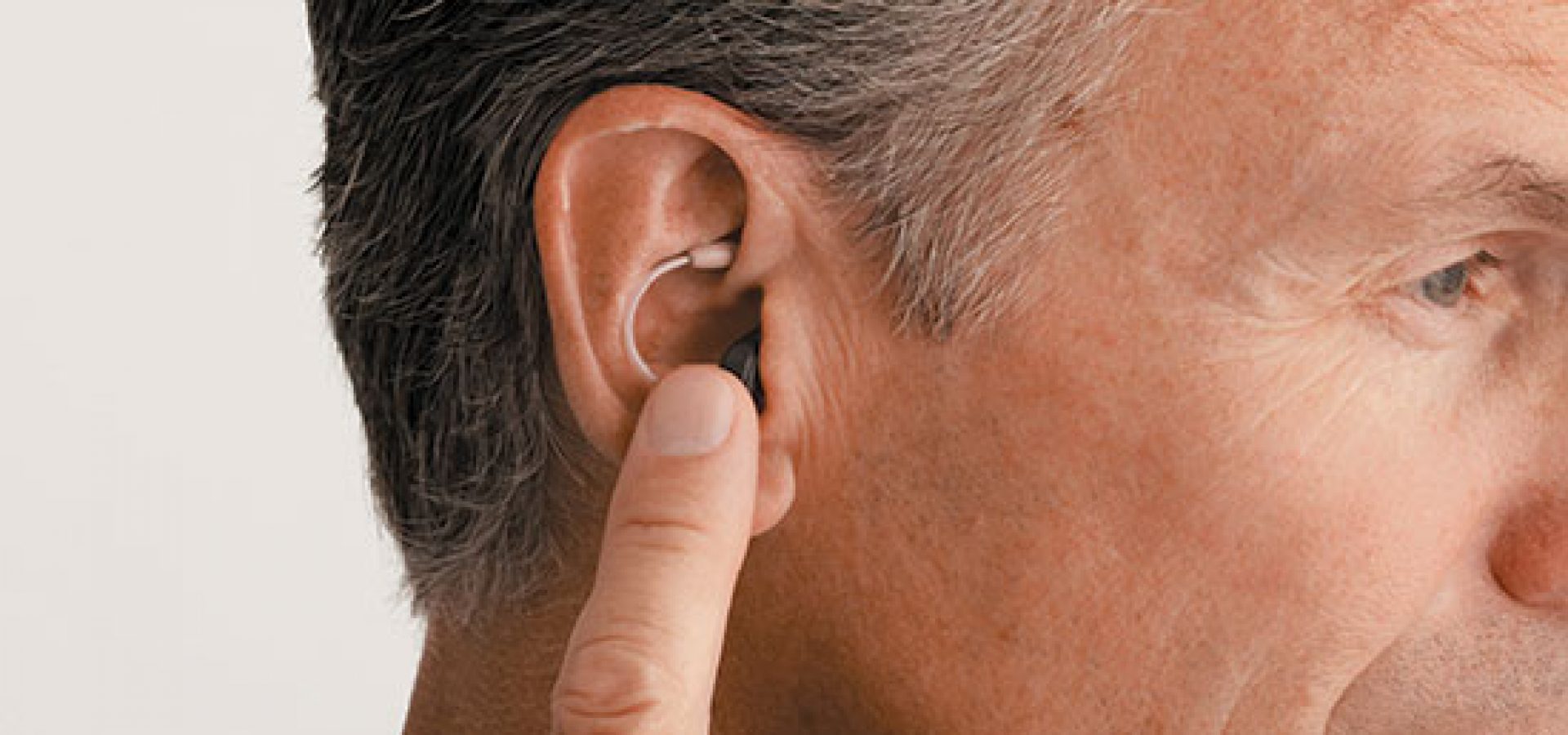 Hearing aid and middle-aged man
